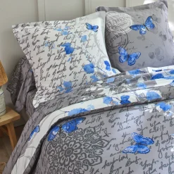 Fantasie Bedlinnen|Vlak Laken<Colombine Bedlinnen in katoen Célestine met bloem- en vlindermotieven blauw / grijs