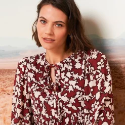 Jurk<Blancheporte Korte, bedrukte jurk, detail van striklintjes bordeaux / beige