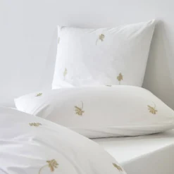 Effen Bedlinnen|Kussensloop<Blancheporte bedlinnen met geborduurde bloemen Colombine® wit